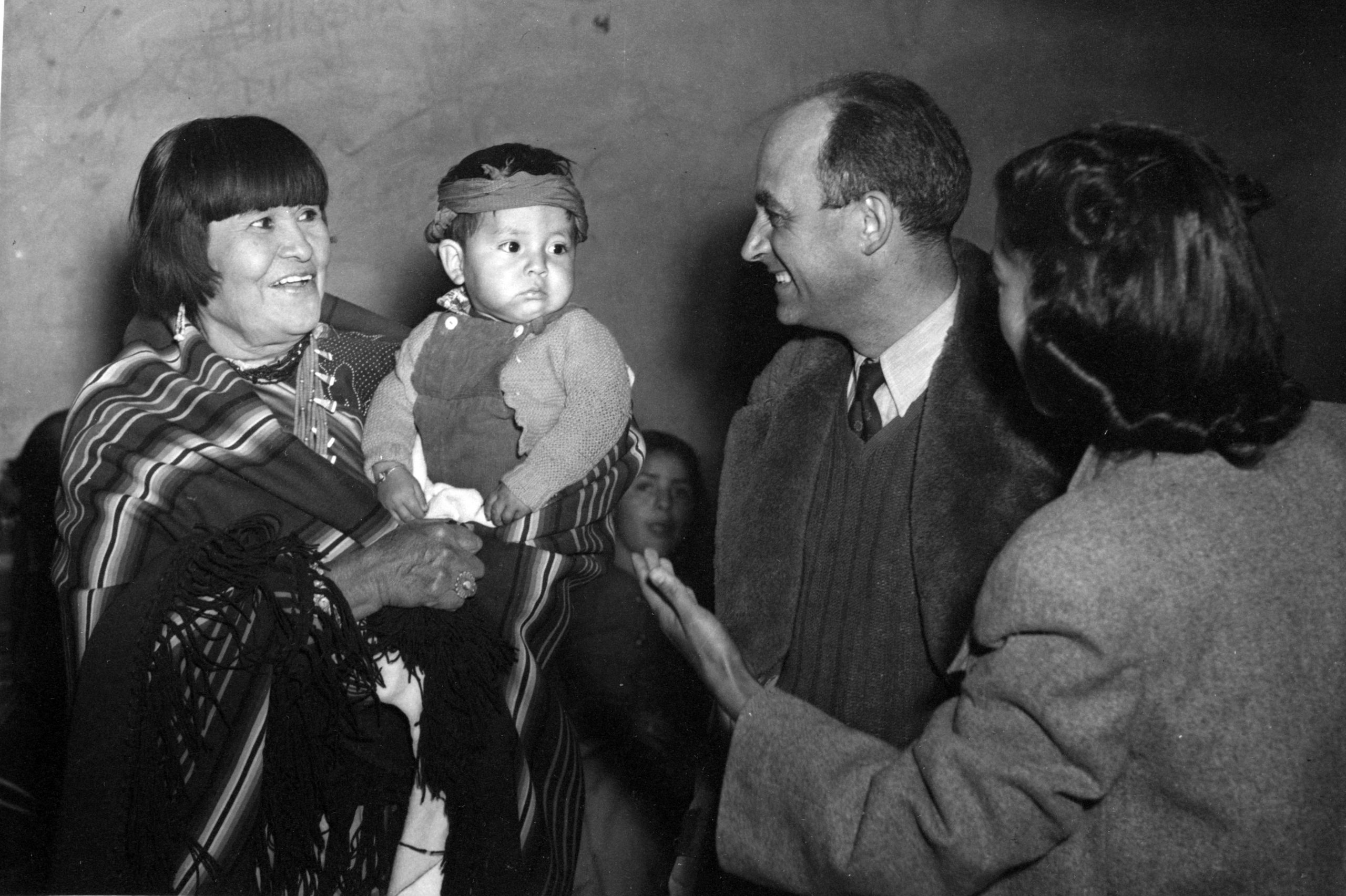 Maria Montoya Martinez and her grandchild with Enrico Fermi. Photo courtesy of the Robert JS Brown Collection.